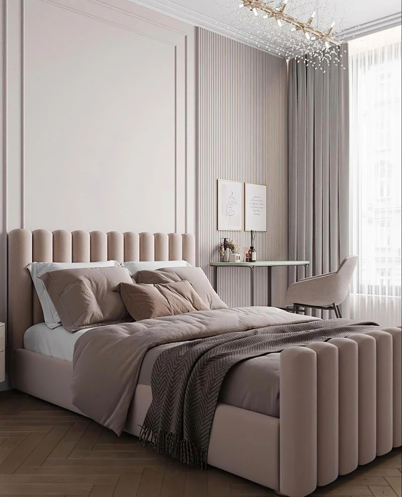 Soft pink upholstered bed with a tall tufted headboard and chic wall paneling in a modern bedroom.